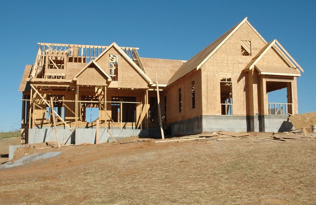 Modern residential framing at golden hour by Framework Builders Inc.